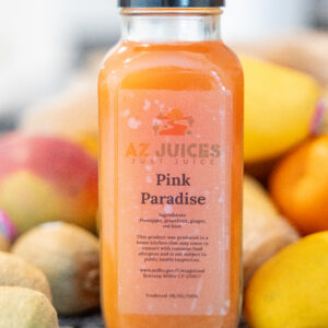 Pink Paradise juice bottle with mangoes