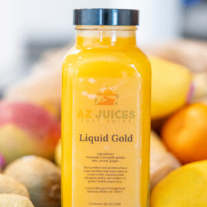 Bottle of mango-orange juice labeled Liquid Gold